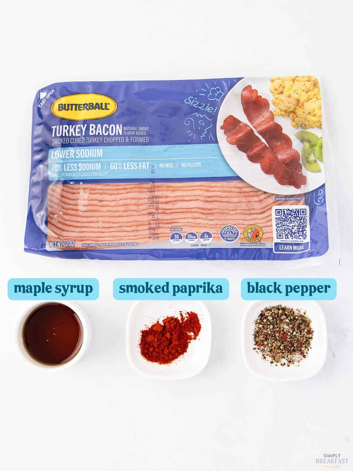 Package of Butterball turkey bacon is at the top, ready for your next breakfast. Below are three small dishes containing maple syrup, smoked paprika, and black pepper—perfect ingredients to enhance your culinary adventure as you learn how to cook turkey bacon to perfection.