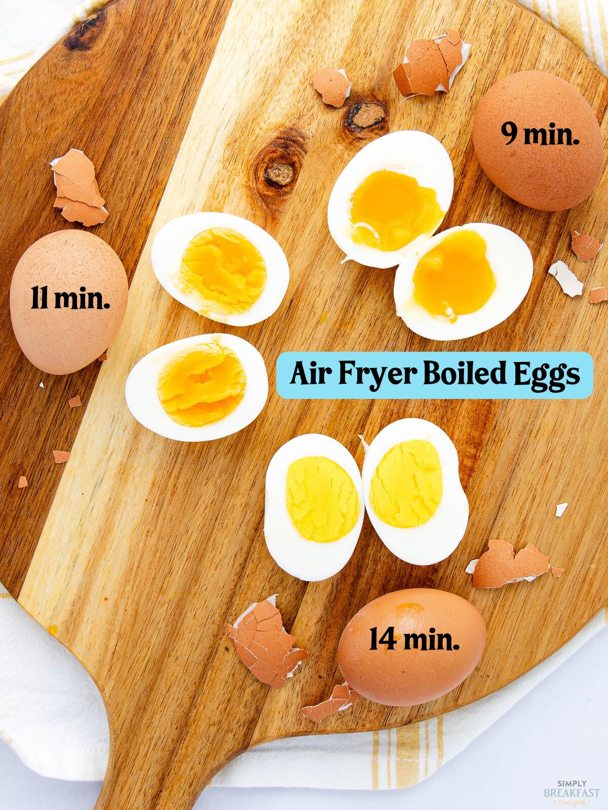 Top view of a wooden cutting board with broken egg shells and six boiled egg halves showing varying yolk consistency. Eggs are labeled "9 min," "11 min," and "14 min." Title in blue reads "Air Fryer Boiled Eggs.