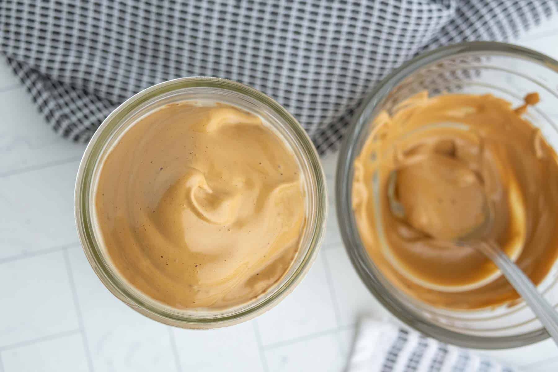 Whipped coffee in a glass jar as seen from overhead.