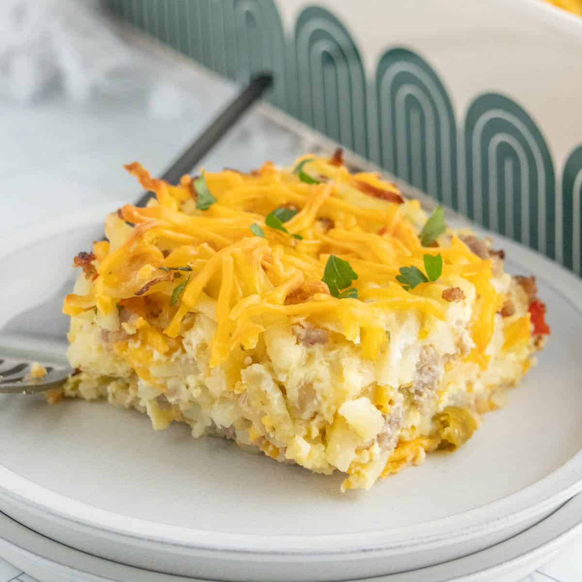 A slice of breakfast casserole on two stacked plates.