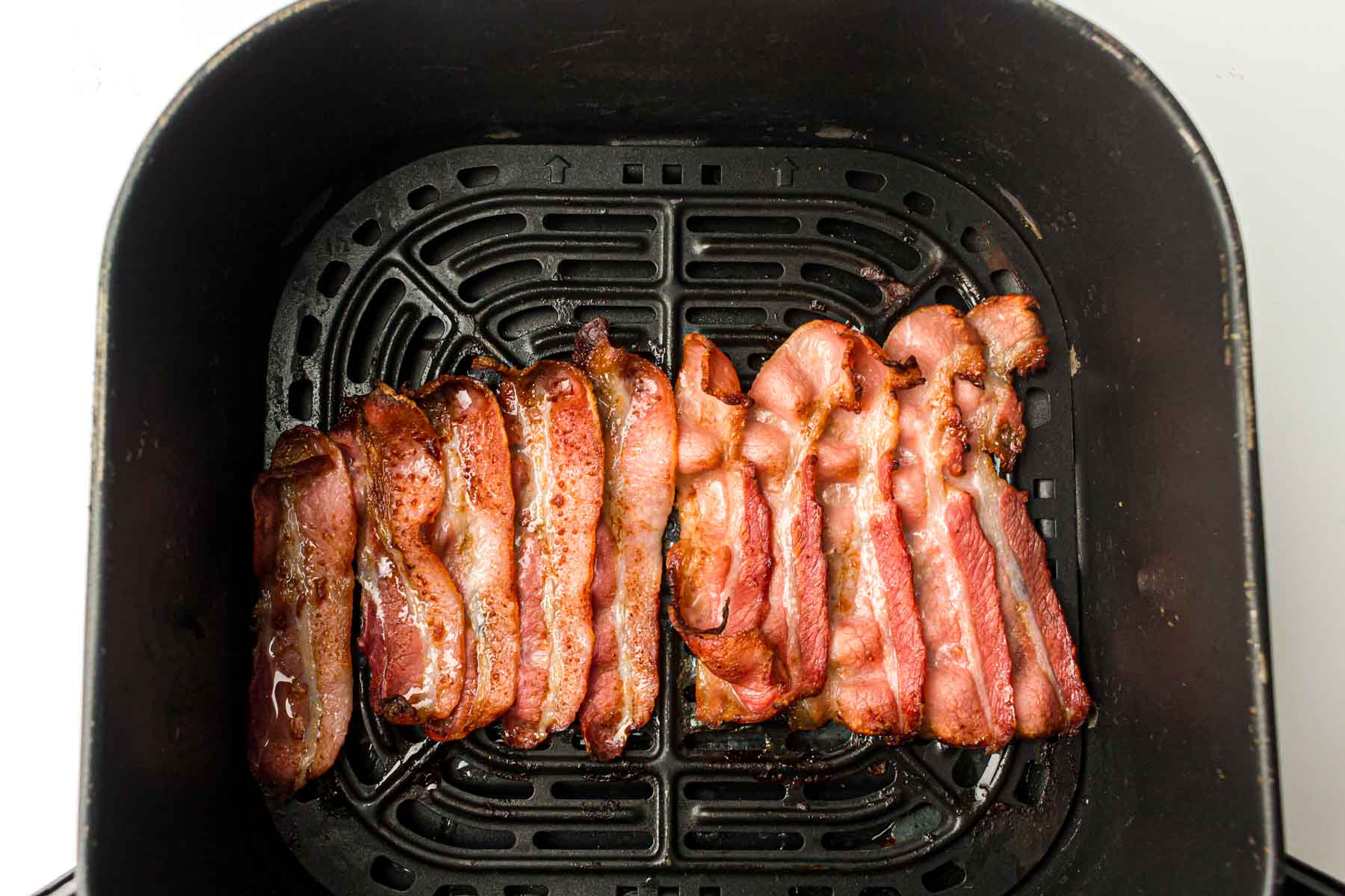 Cooked bacon in an air fryer.