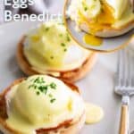 Two English muffins topped with ham, poached eggs, and hollandaise sauce, garnished with chopped chives. A fork and knife are beside the plate. Text reads “Classic Eggs Benedict,” highlighting this beloved brunch favorite.