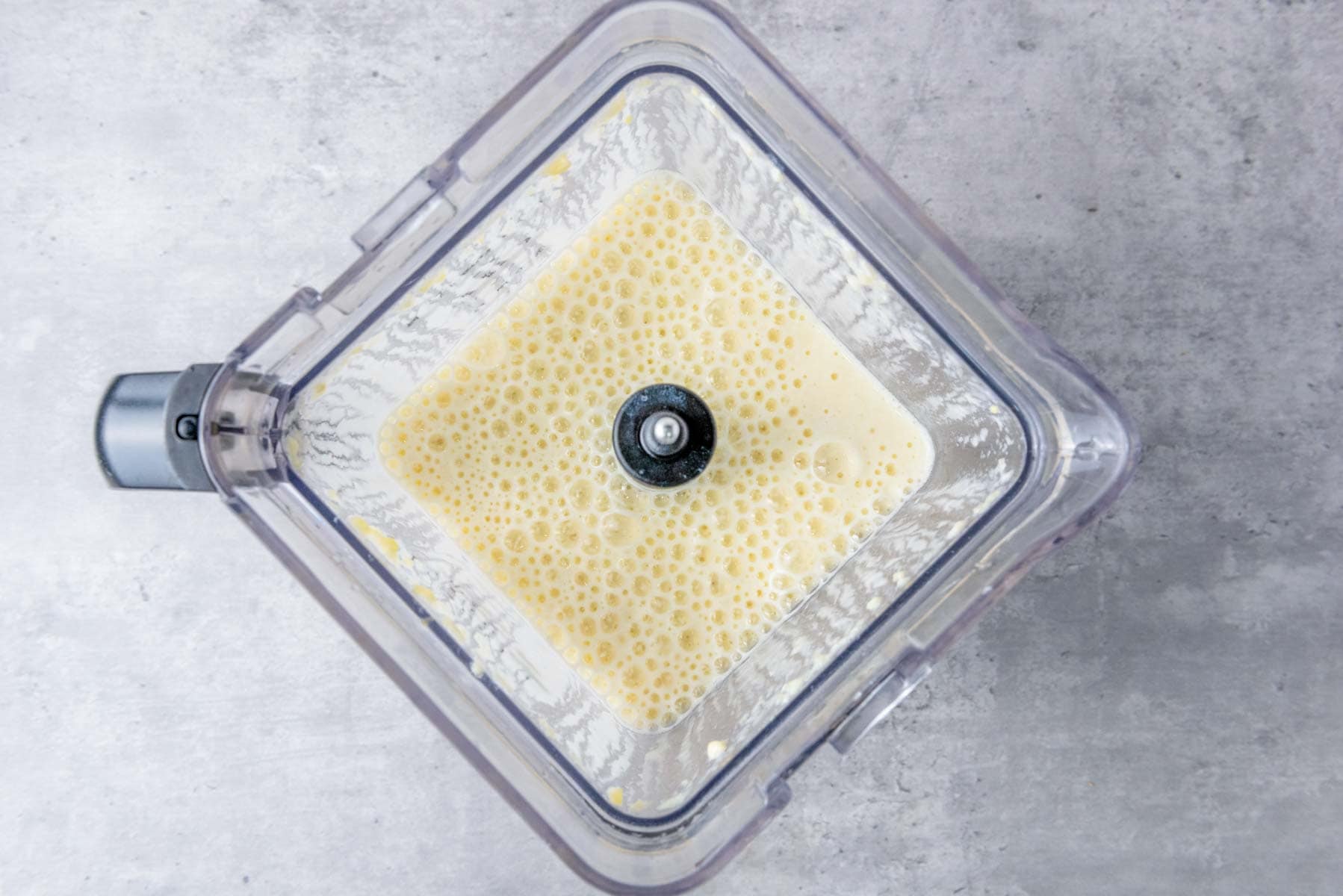 A blender filled with a blended mixture.