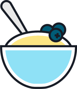 A bowl of yellow porridge or cereal with three blueberries on top and a spoon inside the bowl.