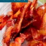 Close-up of crispy candied bacon strips in a glass jar with text overlays reading “Candied Bacon,” “sweet & peppery,” and “Read More.”.